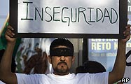 A Tijuana resident displays his unhappiness with the violence