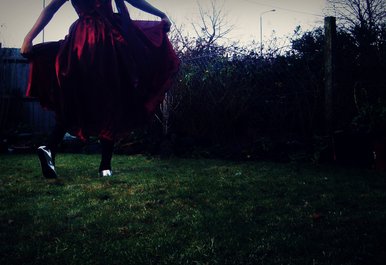 Dancing alone.
