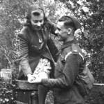 Doris is helped over a style by her fiance, Len (Royal Artillery) 1942, Meldreth in Cambridgeshire Doris is helped over a style by her fiance, Len (Royal Artillery) 1942, Meldreth in Cambridgeshire