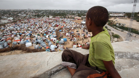 A boy looks down on Seyidka settlement for people displaced by famine.