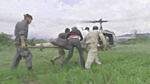 Matt being carried to a helicopter