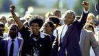 ANC leader, Nelson Mandela and wife Winnie raising fists upon his release from Victor Verster prison after 27 yrs.
