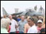 People in front of a plane