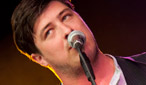 Marcus Mumford of festival openers Mumford And Sons.