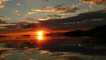sunset over of Rhum and Eigg (photo courtesy of Neil McLaren)