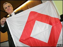 International Red Cross Committee co-operation director Francois Bugnon with the Red crystal emblem