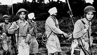 Blindfolded Japanese prisoners are led to the rear of the Chinese lines by Chinese soldiers after their capture on the fighting front in Northern Burma