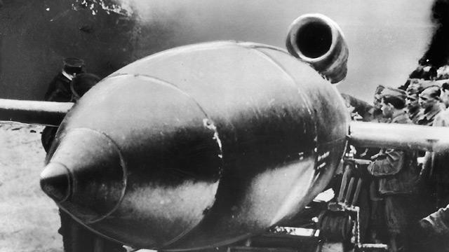 A V-1 'doodlebug' pilotless flying bomb on its launching platform, circa 1944. The background has been retouched by German censors.