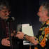 Fairport Convention’s Simon Nicol accepting the trophy for Favourite Folk Track Of All Time on behalf of the late Sandy Denny from conservationist, comedian, author and musician Bill Oddie