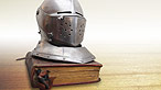 Helmet on a book - www.istockphoto.com