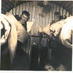 In the Anderson shelter, 1941, are Cyril (top left), David (top right), and me (bottom right)