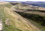 At 1,800 ft long, Maiden Castle is one of the largest and most completely excavated hill forts in Britain