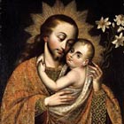 Joseph cuddles the baby Jesus