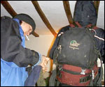 the two women put on their rucksacks