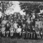 Residents of Derwent Rd and Trent Rd, Ipswich posing before their VE Day street party, held on 8th May 1945. Where are the men?