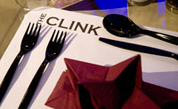 A table in The Clink restaurant set with plastic cutlery