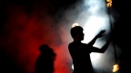 Silhouette of flame thrower