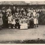 D'Eynsford Road, Camberwell VE Day street party. My three sisters and cousin, who were evacuated to Warrington, are here. I am on the left-next to the boy with the buttonhole. D'Eynsford Road, Camberwell VE Day street party. My three sisters and cousin, who were evacuated to Warrington, are here. I am on the left-next to the boy with the buttonhole.