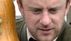 While he may look sinister, he's just looking after his vegetable