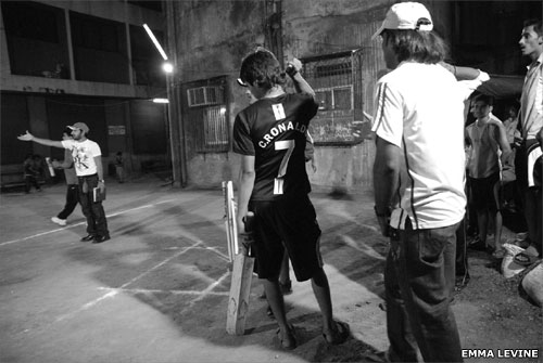Men playing cricket