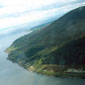 Where the mountains sweep down to the sea...