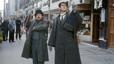Rushton and Cleese as Watson and Holmes